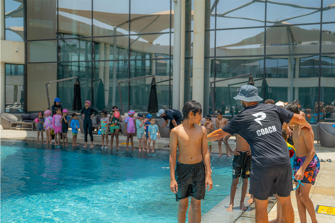 Children participating in a Primal Fitness swimming lesson